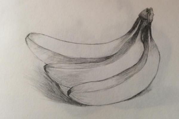 用素描画香蕉的方法，用直线勾出香蕉的位置和轮廓